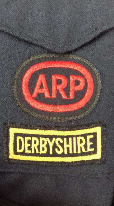 Derbyshire area title with ARP badge on battledress blouse.