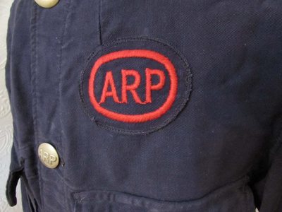 Close up of ARP Bluette Overalls insignia