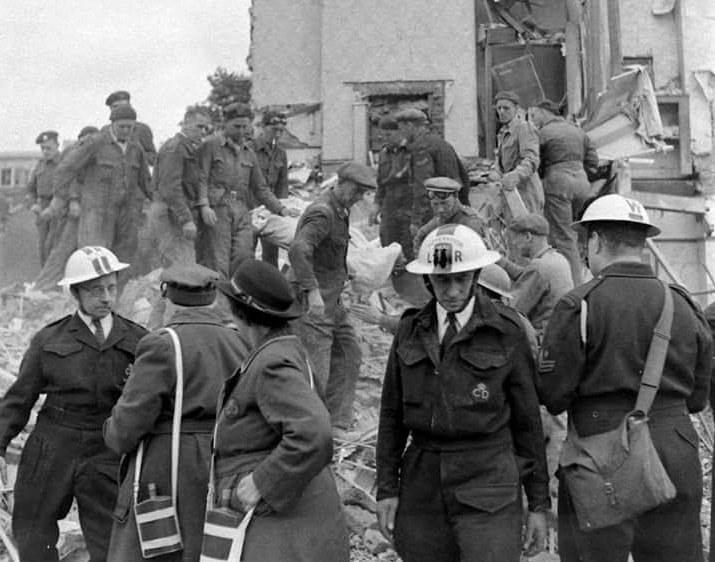 PicturAn air raid incident with three white-helmet Civil Defence servicemen and rescue squad.