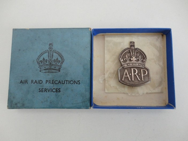 Silver ARP pin badge for female air raid wardens and presentation box