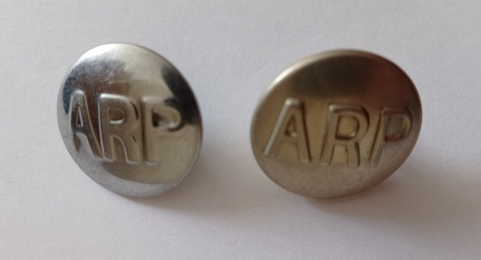 Two types of ARP buttons used on Civil Defence uniforms (front)