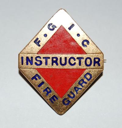 Fire Guard Instructors Course (FGIC) gold-coloured, nationally trained badge.