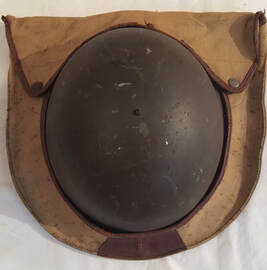 Canvas and leather helmet carrier