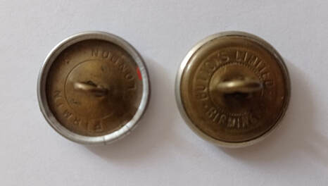 Two types of ARP buttons used on Civil Defence uniforms (rear)