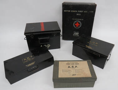 Various styles of WW2 First Aid Boxes