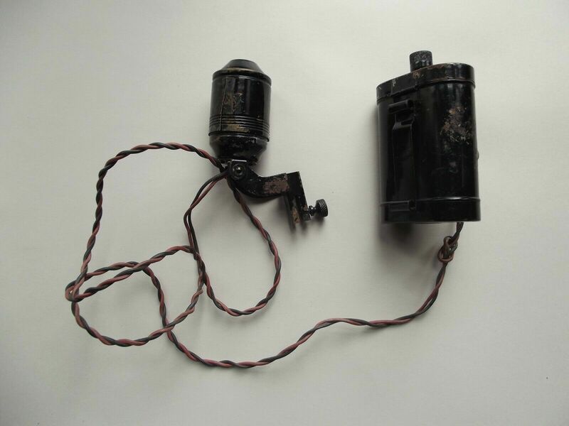 Battery holder with belt clip and lamp head