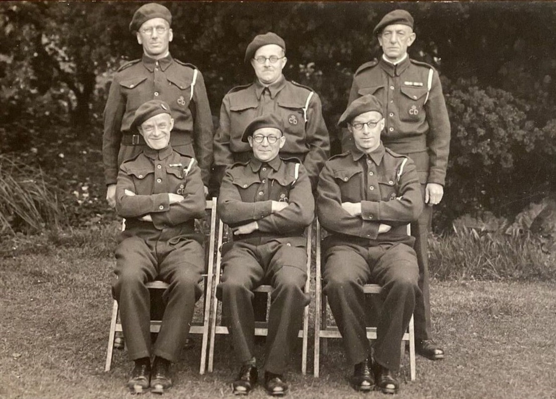 Six second world war Civil Defence members pose for the camera