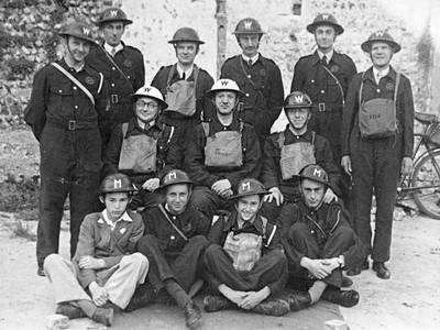 Early war group photo with ARP Wardens in bluette overalls with Messengers.